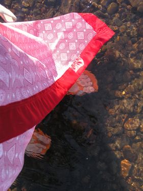 red 46: looking down at my feet in orange flip flops with red skirt, in the Willamette River -- June 2004: photo by Sienna